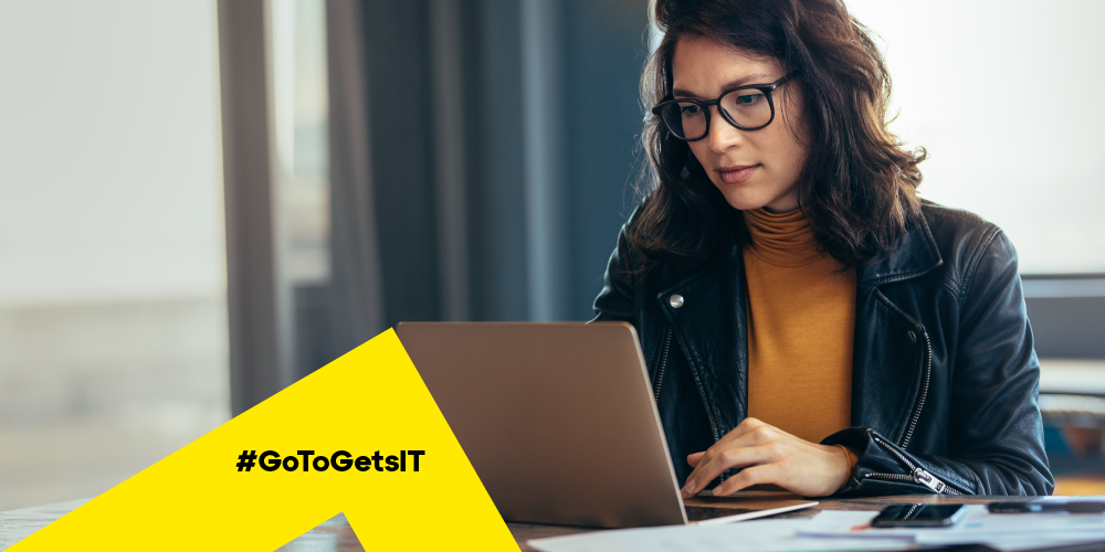 Woman working remotely with her feet up using a laptop secured by the patch management lifecycle