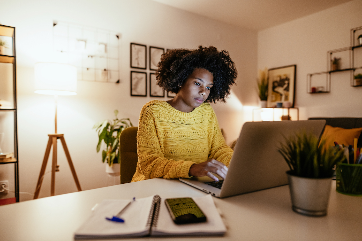 Woman working from home on a laptop after a global pandemic and subsequent economic headwinds